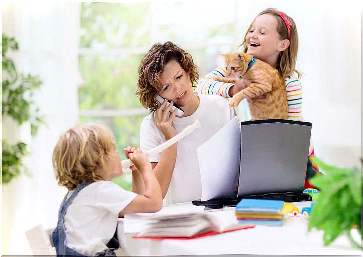 Woman working with children around her