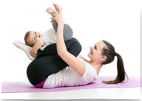 baby lying on mother's shin