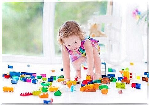 Girl playing with bricks