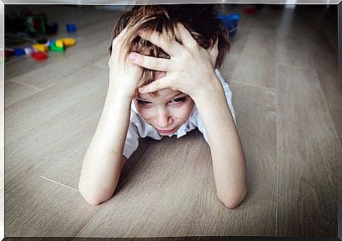 frustrated boy lying on the floor