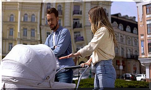 parents arguing by stroller