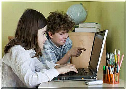 Children are learning to write on a computer