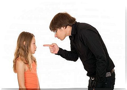 father reprimanding girl