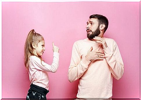 little girl reprimanding dad