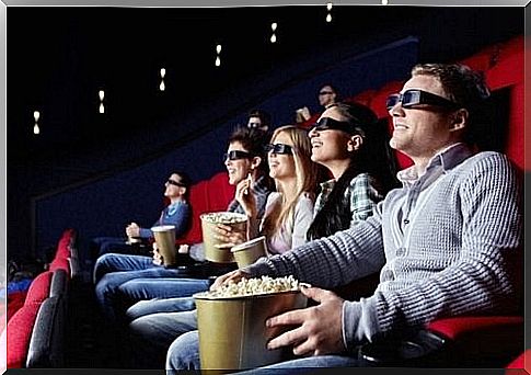 people eating popcorn in cinema