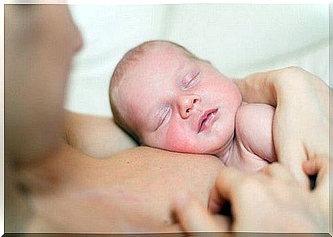 baby with his mother after birth