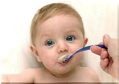 baby being fed with spoon