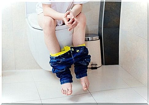 Child sitting on the toilet