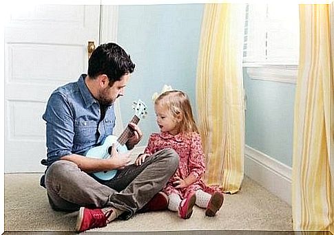 father and daughter playing music