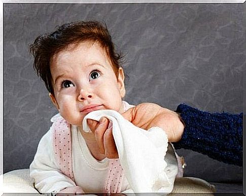 small child being dried around the mouth