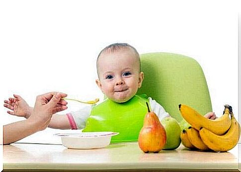 happy baby getting food