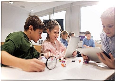 children using tablets at school