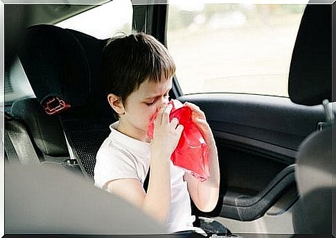 a child is ready to vomit in the car due to motion sickness