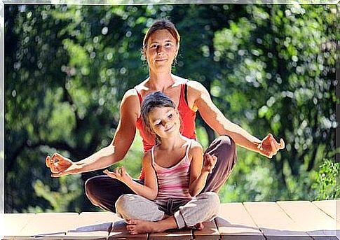 mother and daughter relaxing with meditation