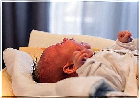 The baby is also crying on the changing table