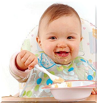 baby eating even with a spoon