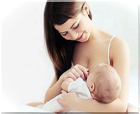 mother breastfeeds her baby