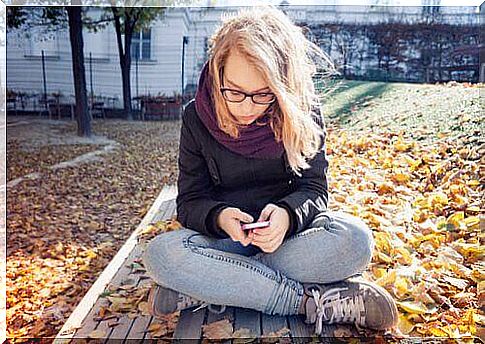 young woman with her mobile