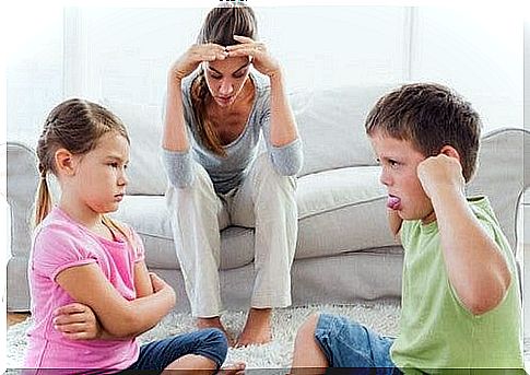 mother is stressed while children quarrel