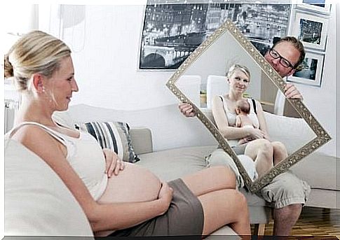 Pregnant woman in the mirror - maternal love