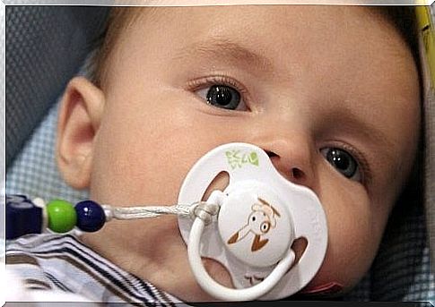 baby with pacifier in mouth