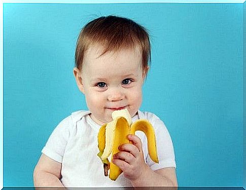 baby eats a banana