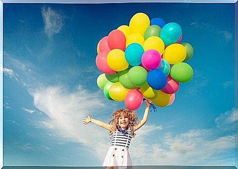 girl running with balloons