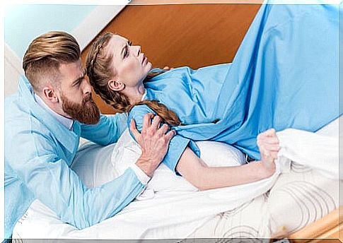 man helping woman at birth