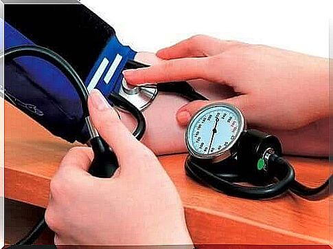 person measuring blood pressure