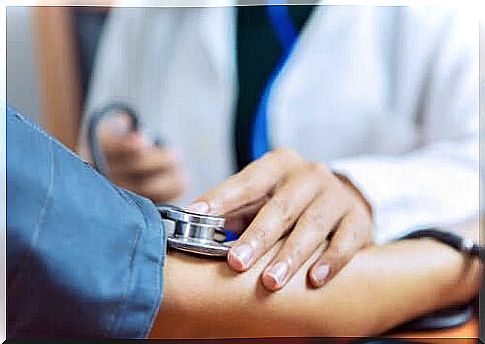 woman getting blood pressure measured