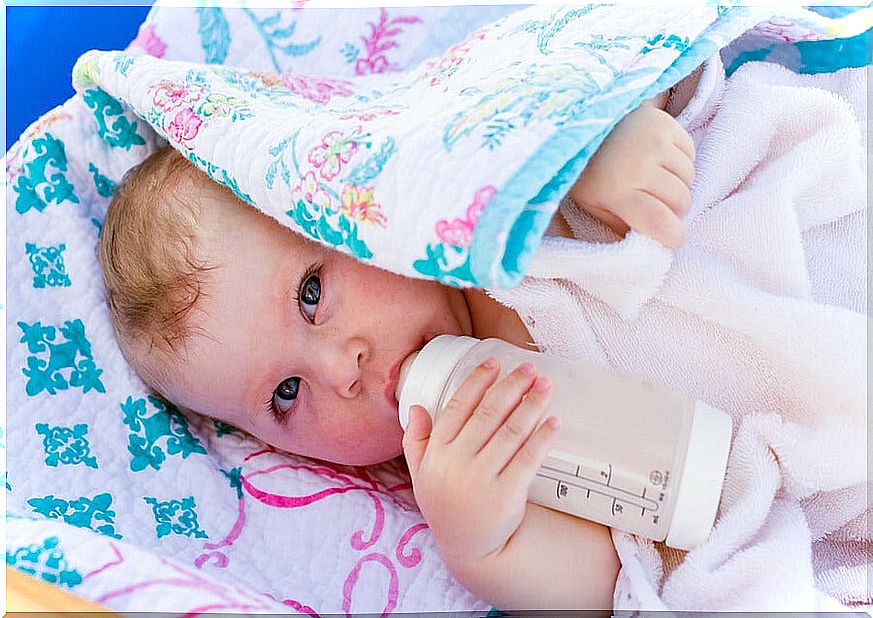 baby with feeding bottle