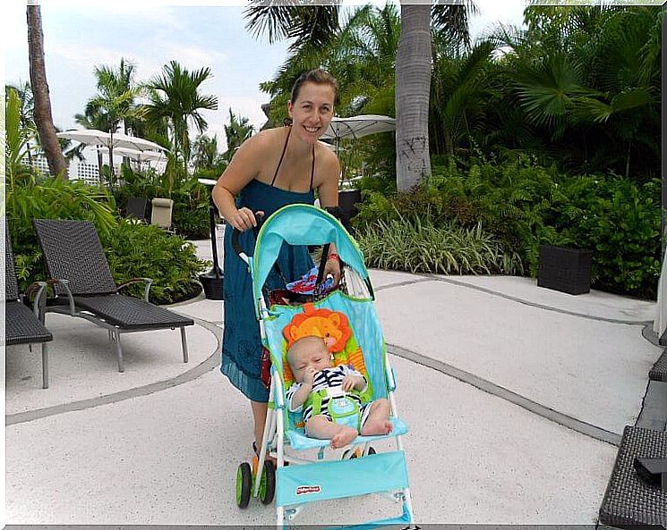 Mother with a baby in the stroller