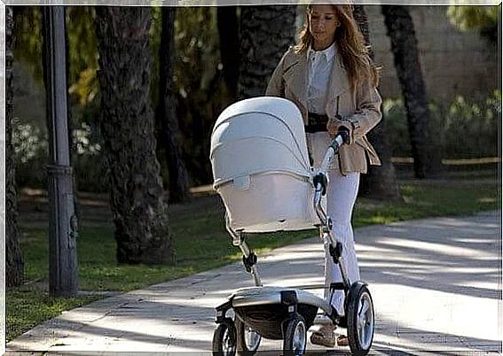 Mother walks with her baby