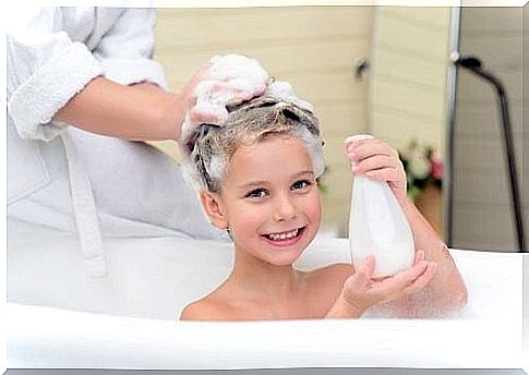 Girl gets help with hair washing