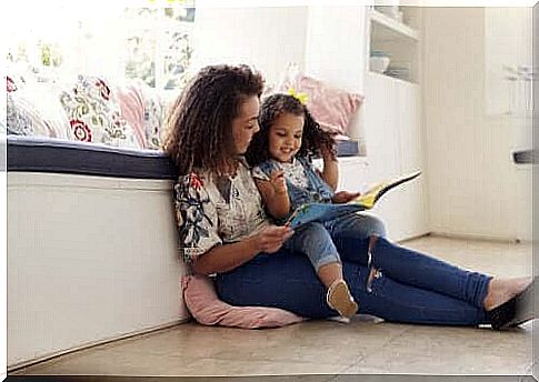 mother reading to her daughter