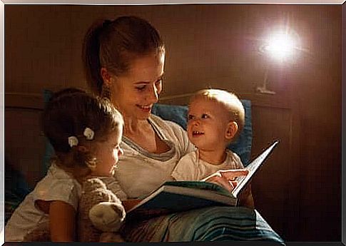 mother reading for her two children