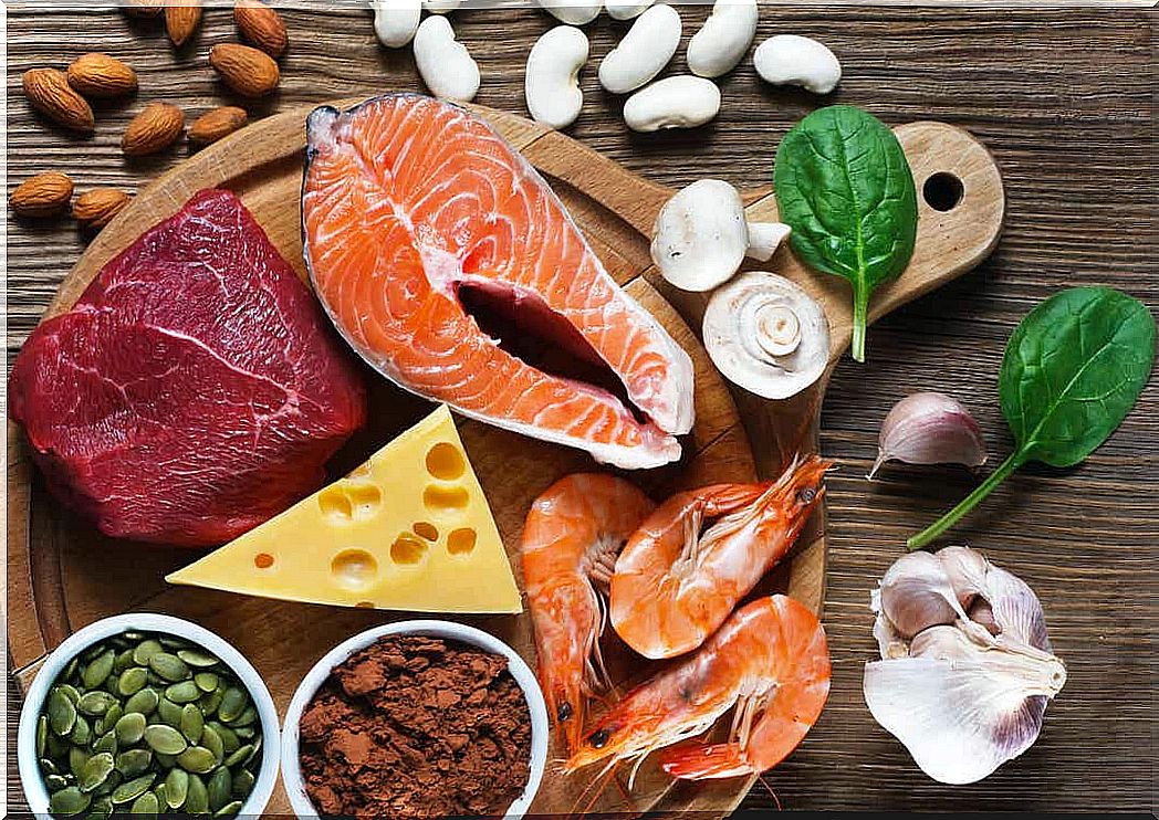 Various food sources for zinc, including salmon, shrimp, meat, cheese, seeds and legumes